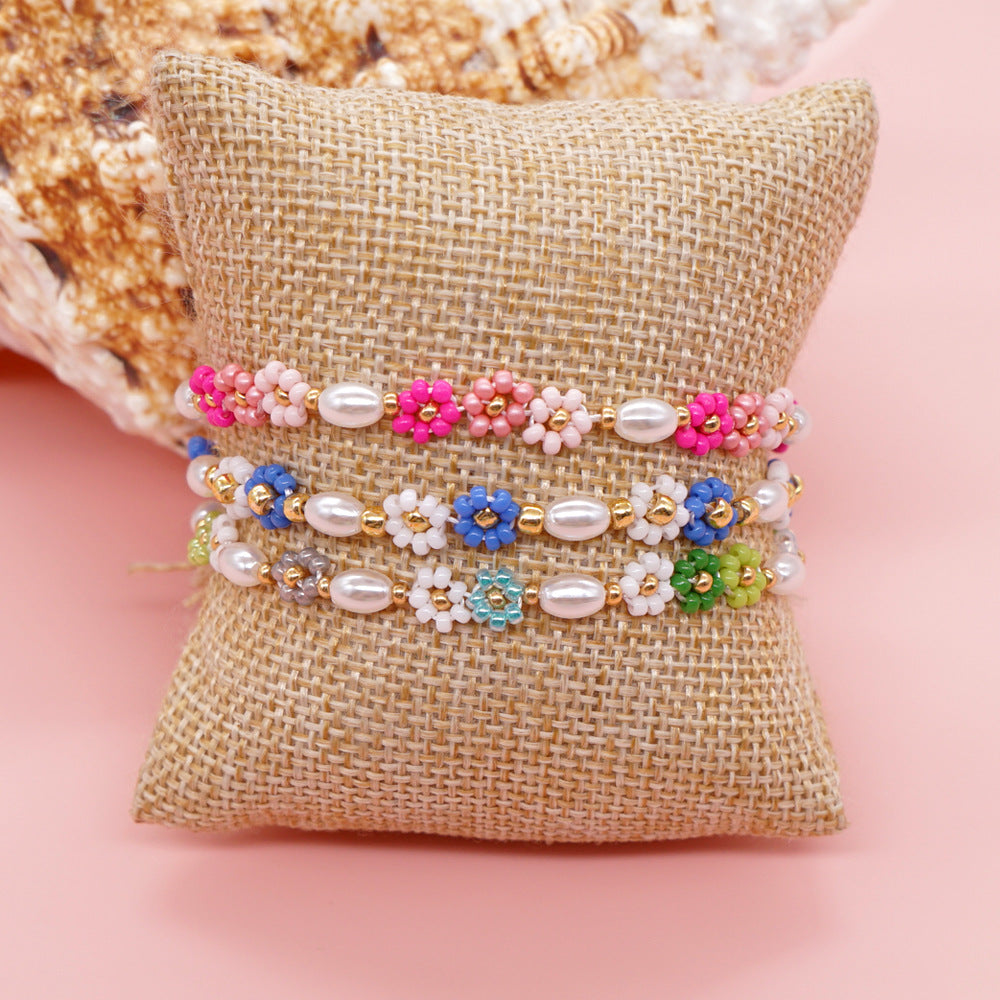 Ojos navideños al por mayor flor anillo de oro sonriente hebilla pulsera de vidrio elástico